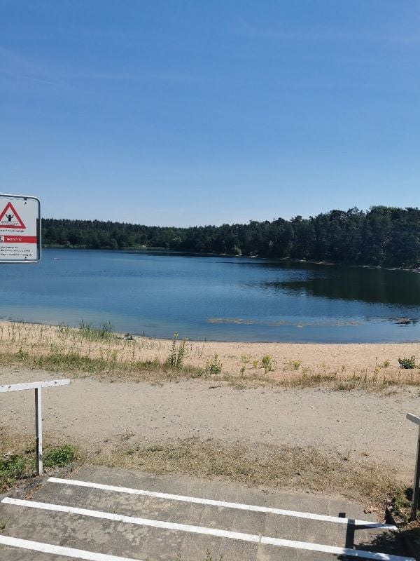Escape to the serene Badestelle Walldorfer See Beach in Frankfurt, one of the most beautiful places in Frankfurt