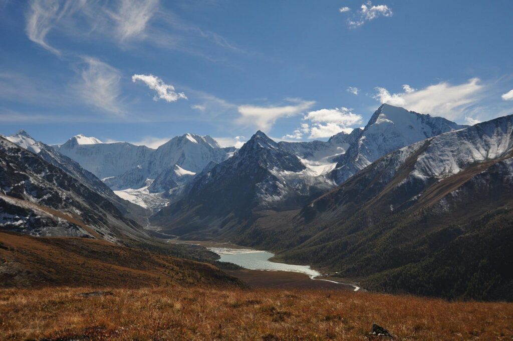 Snow-capped Belukha Mountain with a river valley below.