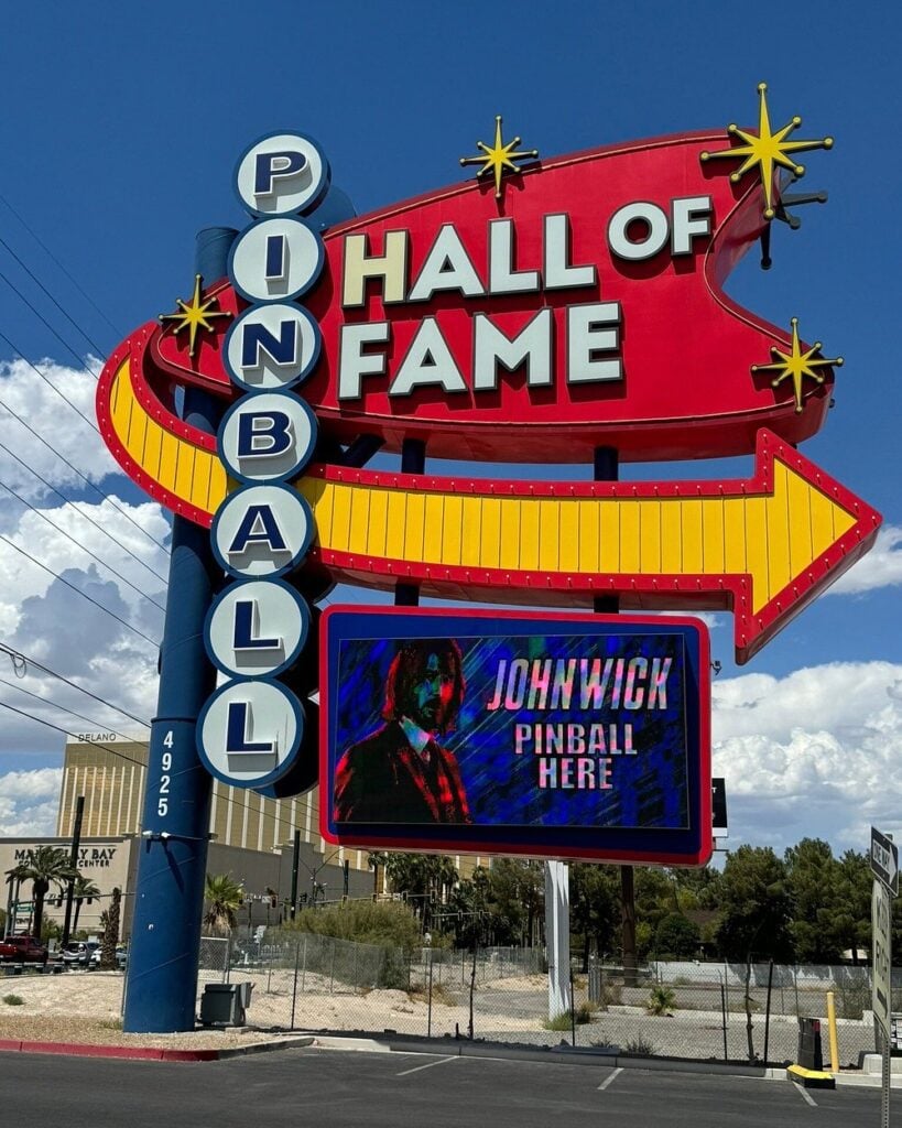 Pinball Hall of Fame sign in Las Vegas with John Wick pinball advertisement.
