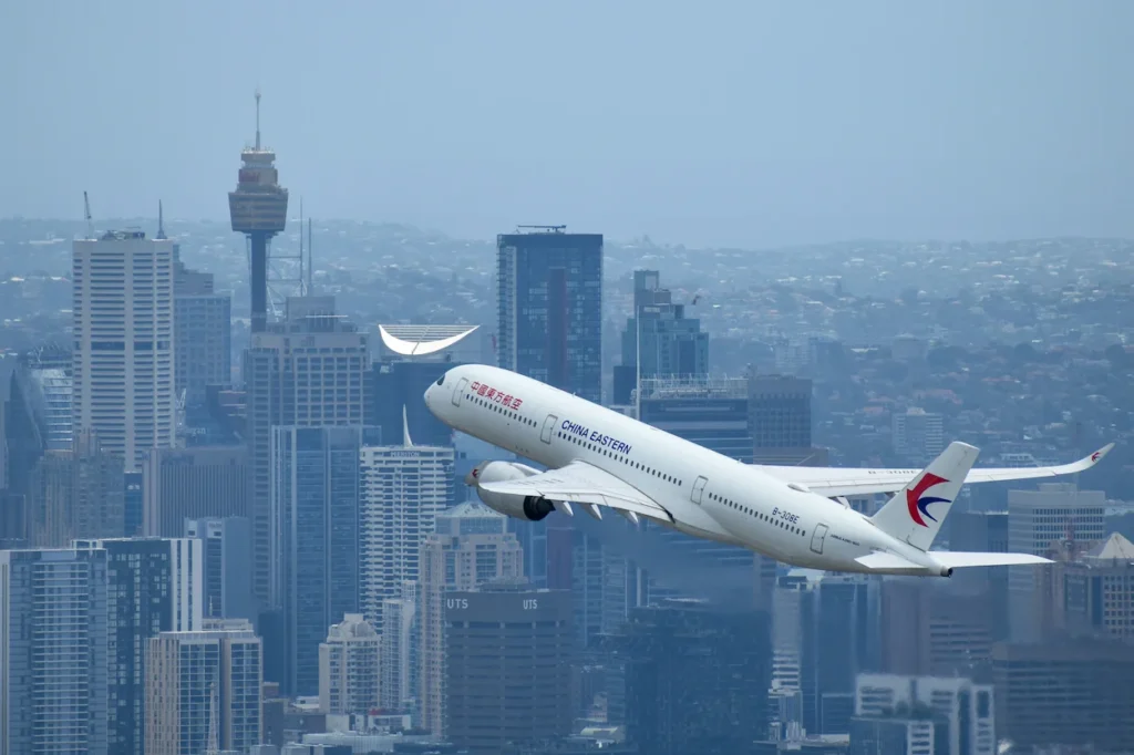China Eastern Airlines Airbus A350-900 passenger airplane climbing through the air