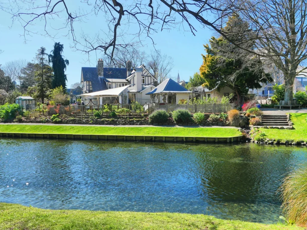 Tudor style house across the calm Avon River in Christchurch