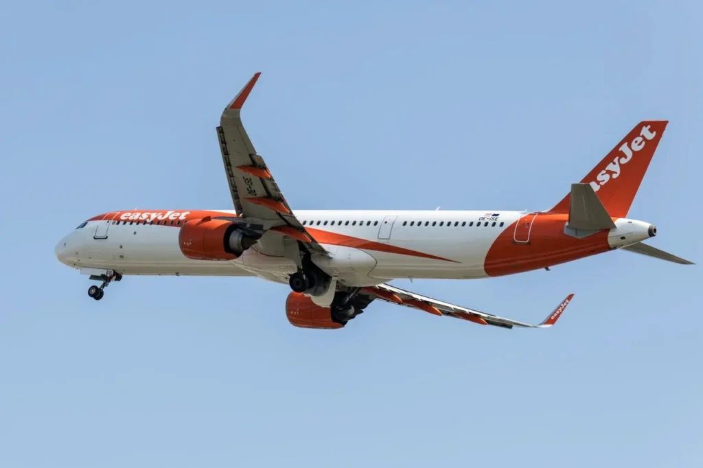 An easyJet Europe Airbus A321neo passenger airplane with registration OE-ISE descending for landing