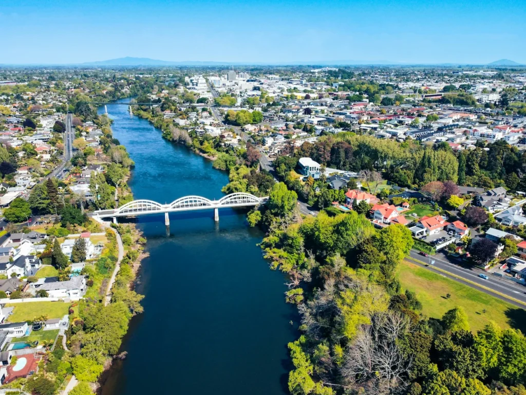 Aerial view of Fairfield Bridge spanning the blue Waikato River in Hamilton city