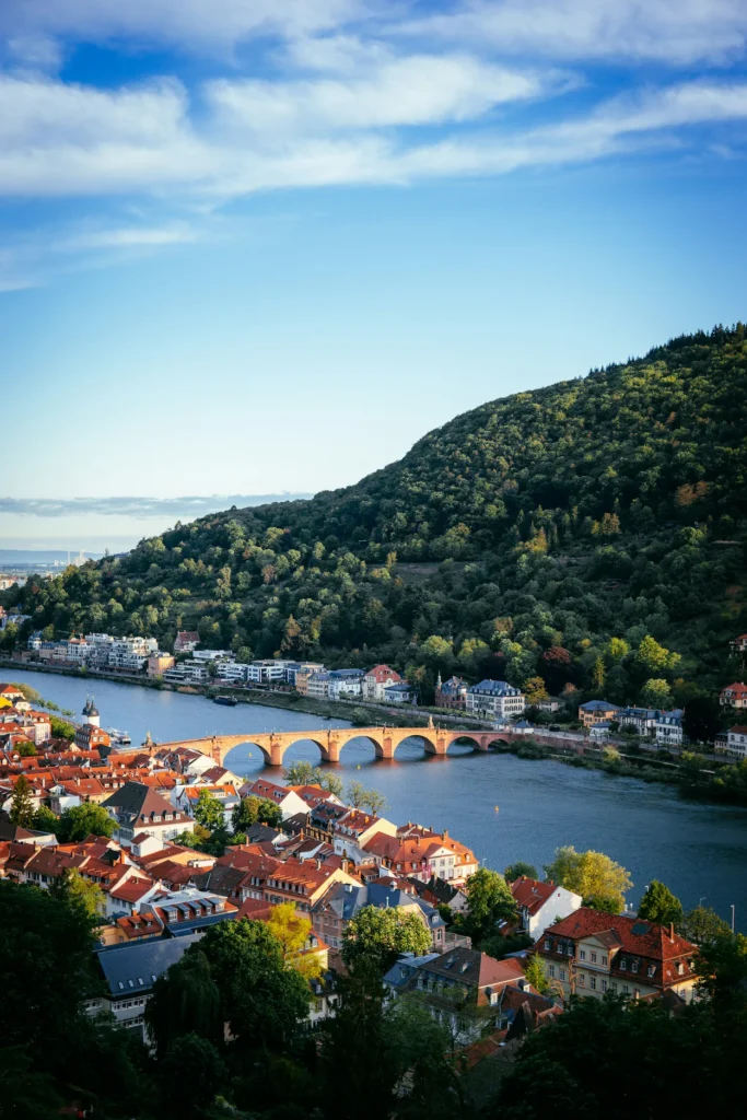 High-angle view of the arched red sandstone Karl Theodor Bridge over the Neckar River