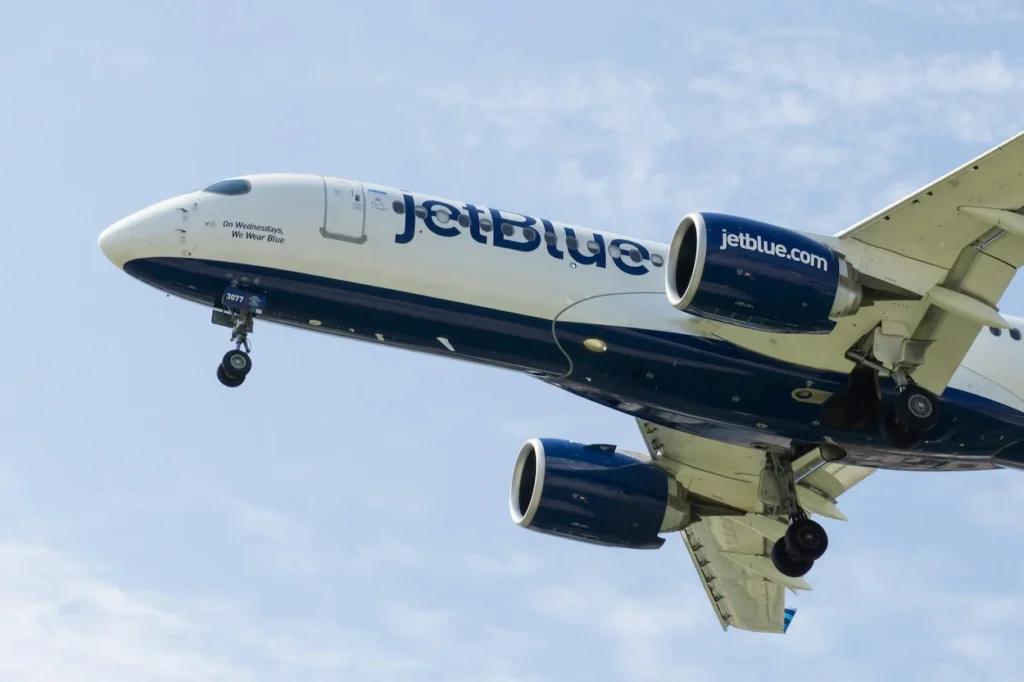 A JetBlue Airways Airbus A220-300 passenger airplane descending on final approach