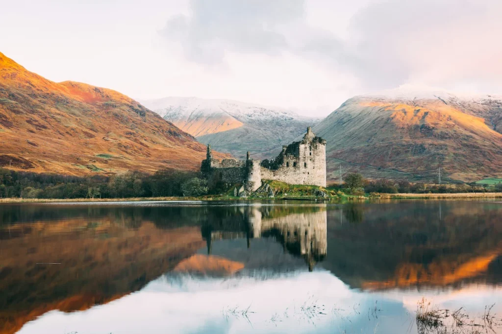 The ruins of Kilchurn Castle perfectly mirrored in the calm waters of Loch Awe