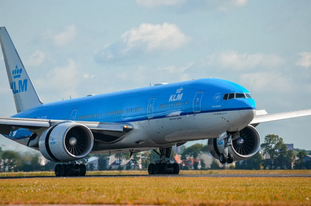 KLM Royal Dutch Airlines Boeing 777 widebody airplane taxiing on an airport runway