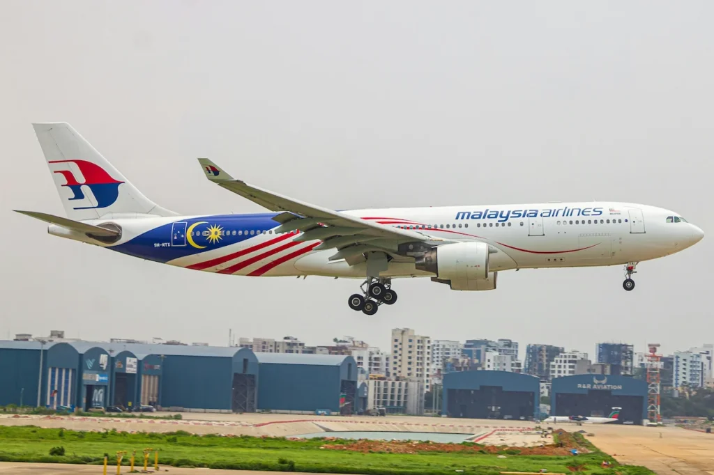 Malaysia Airlines Airbus A330 passenger airplane in Negaraku flag livery preparing to land
