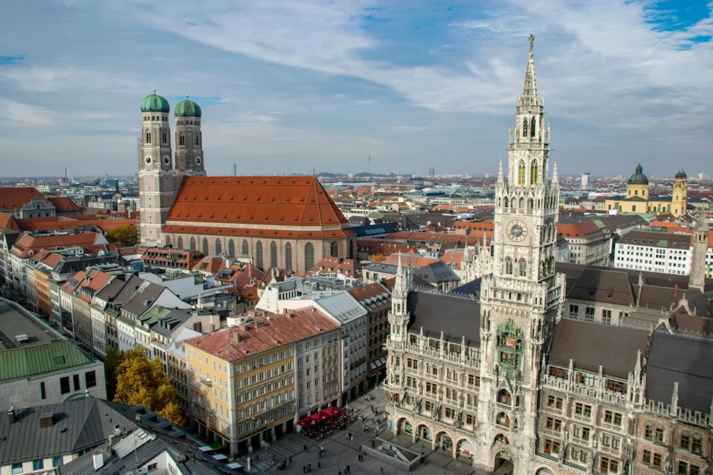 The New Town Hall tower and Frauenkirche cathedral overlooking Marienplatz in Munich, Germany