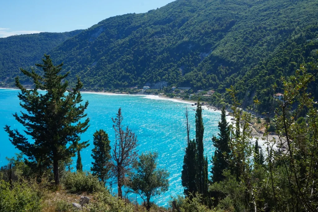 Turquoise waters of Mylos Beach in Lefkada framed by green hills