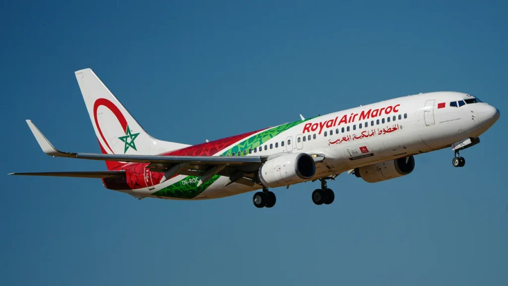 Royal Air Maroc Boeing 737 passenger jet descending for landing with landing gear down