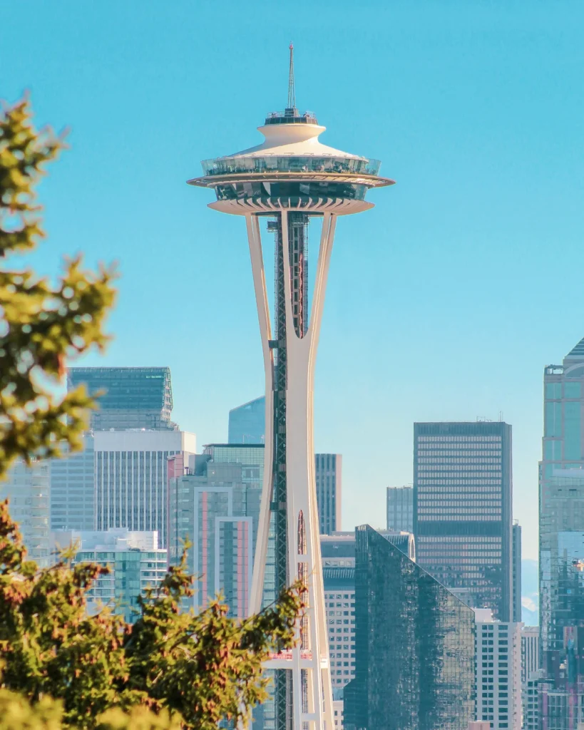 The Space Needle observation tower standing above downtown Seattle skyscrapers