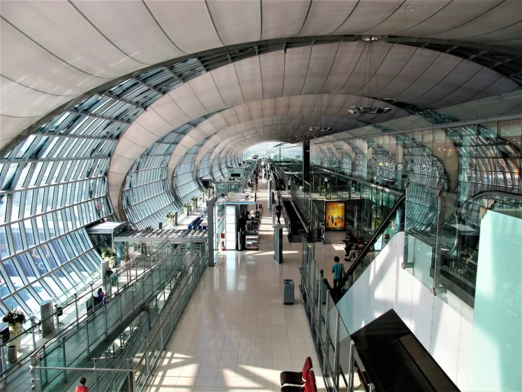 Vaulted glass and steel architecture inside the Suvarnabhumi Airport terminal in Bangkok, Thailand