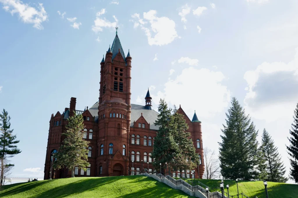 Historic red-stone Romanesque facade and tower of Crouse College at Syracuse University