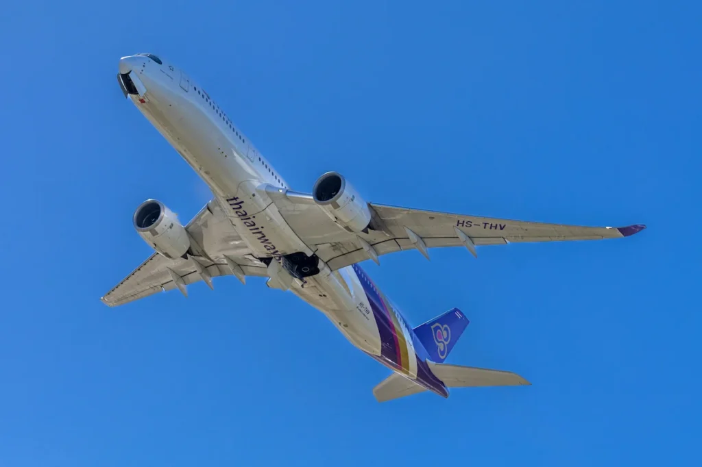 Underbelly view of a Thai Airways Airbus A350-941 registration HS-THV flying overhead