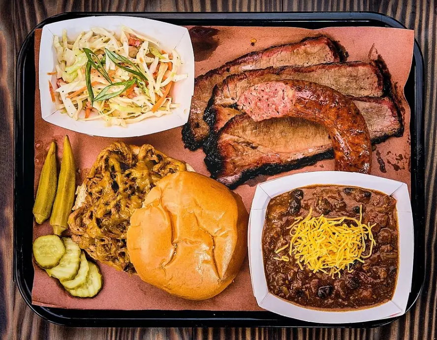 House made slaw, Avril-Bleh sausage, mouth-watering brisket, brisket chili, and pulled pork samm