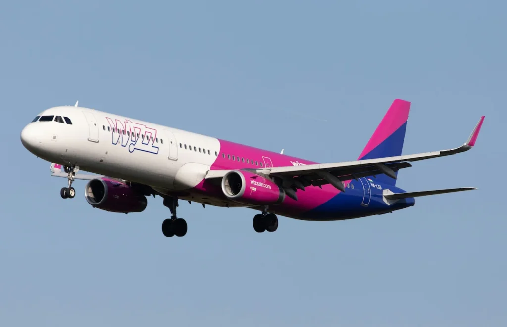 Wizz Air Airbus A321neo passenger airplane with registration HA-LIG descending for a landing