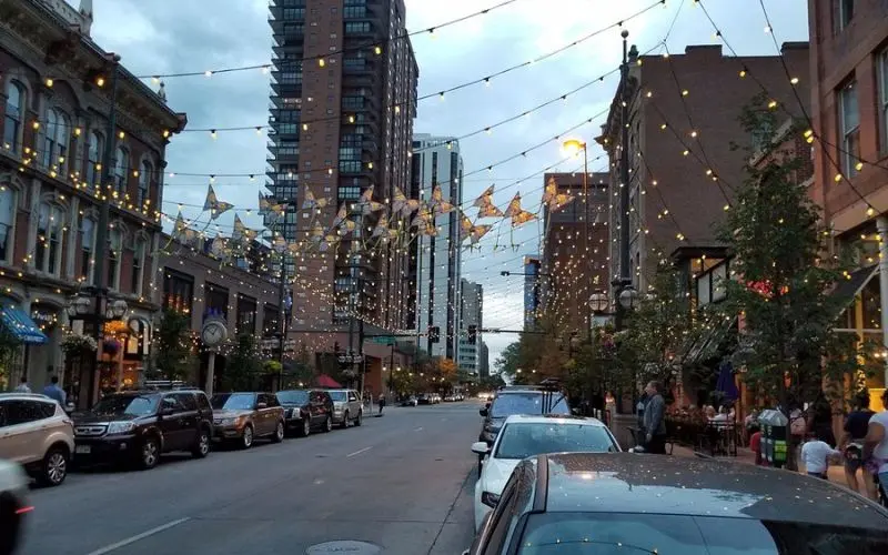 String lights hang above the street at Larimer Square in Denver.
