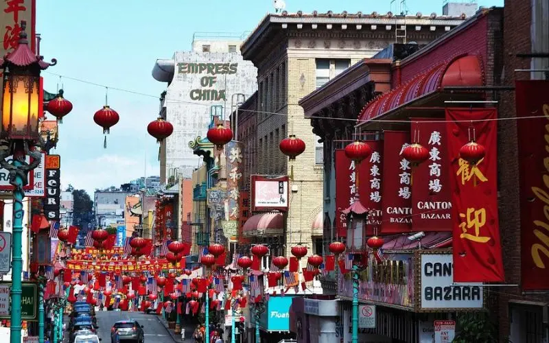 Red lanterns hanging above the busy street in Chinatown.