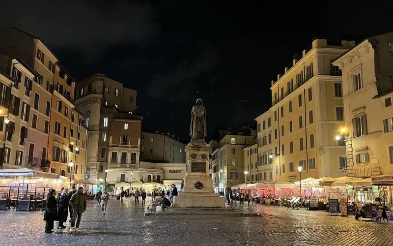 Campo de’ Fiori in Rome, Italy with statue and night market.