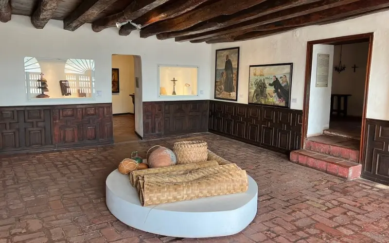 Interior exhibits with religious artifacts at San Pedro Claver Church and Convent.