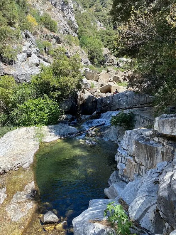 A clear pool and rocky cascades along the Marble Falls Trail.