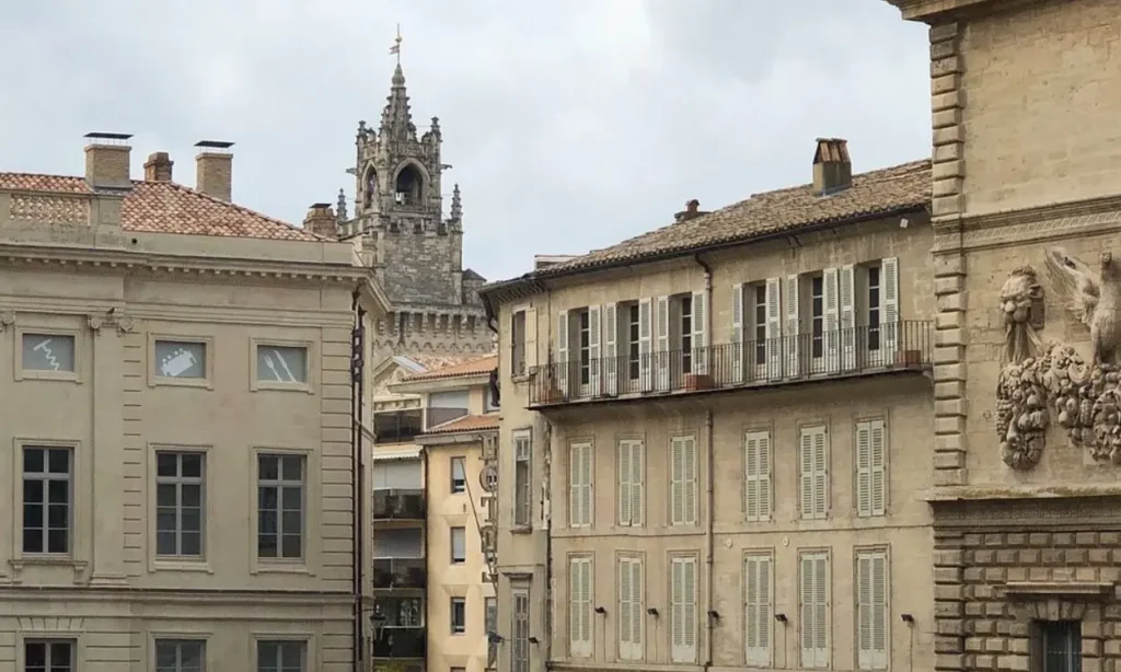 The tower and historic buildings around Place Crillon in Avignon.