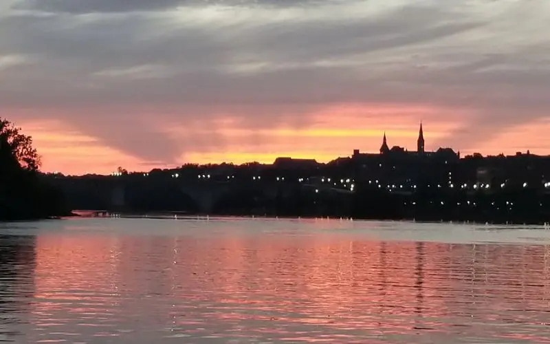 The Georgetown Waterfront Park at sunset with views of the Potomac River.