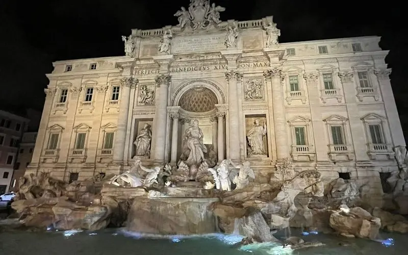 Trevi Fountain in Rome, Italy illuminated at night.
