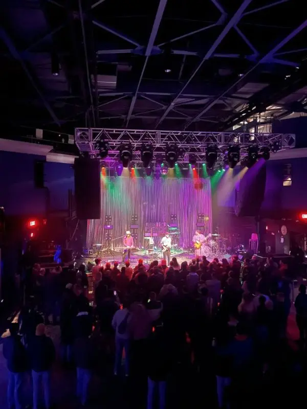 A live concert with colorful lights at the 9:30 Club in Washington, DC.