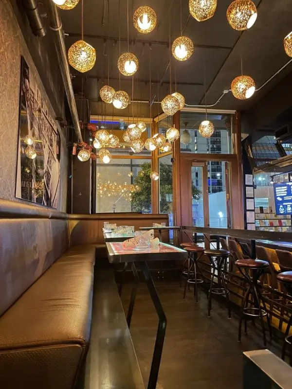 Hanging lights glow warmly inside Ophelia’s Electric Soapbox restaurant and music venue.