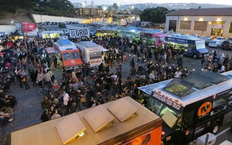 Large crowd enjoying food trucks at Off the Grid.