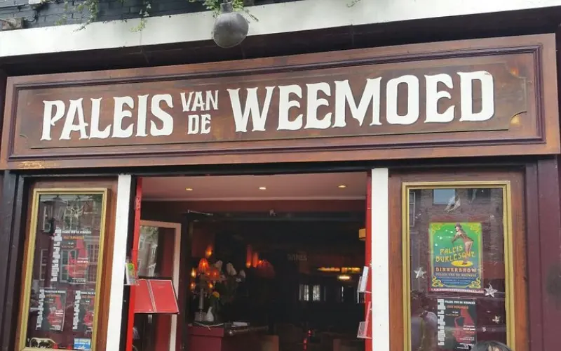 Entrance of Paleis van de Weemoed cabaret restaurant with bold signage.