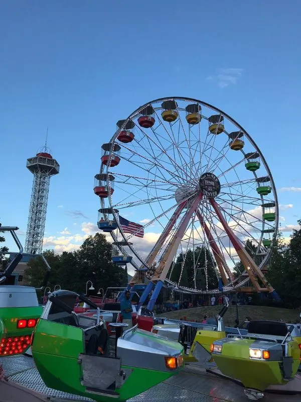 A Ferris wheel and rides stand tall at Elitch Gardens Theme & Water Park.