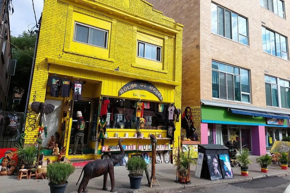 A bright yellow building of House of Moses shop in Kensington Market.