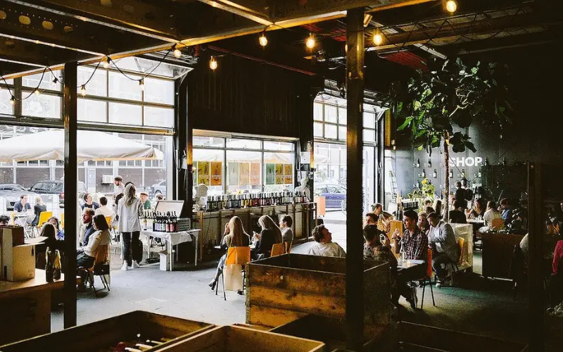 People dining inside Chateau Amsterdam urban winery.