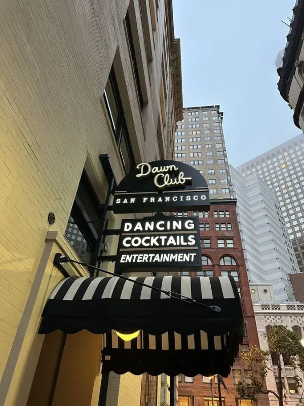 Black and white marquee sign of The Dawn Club in San Francisco.