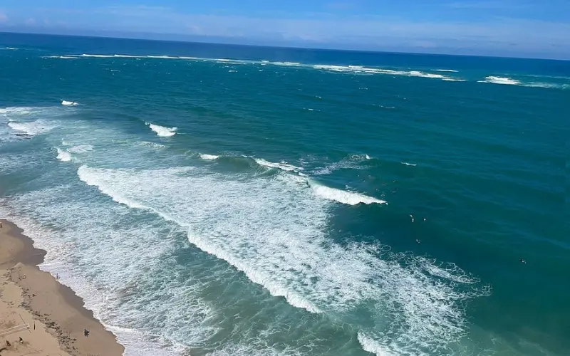 Waves crash along the shore at Condado Beach.