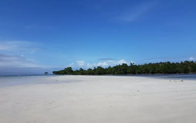 A wide stretch of white sand meets the sea at Cagbalete Island.