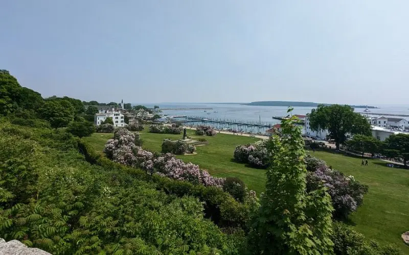 Gardens and open lawns overlook the harbor at Mackinac Island State Park.