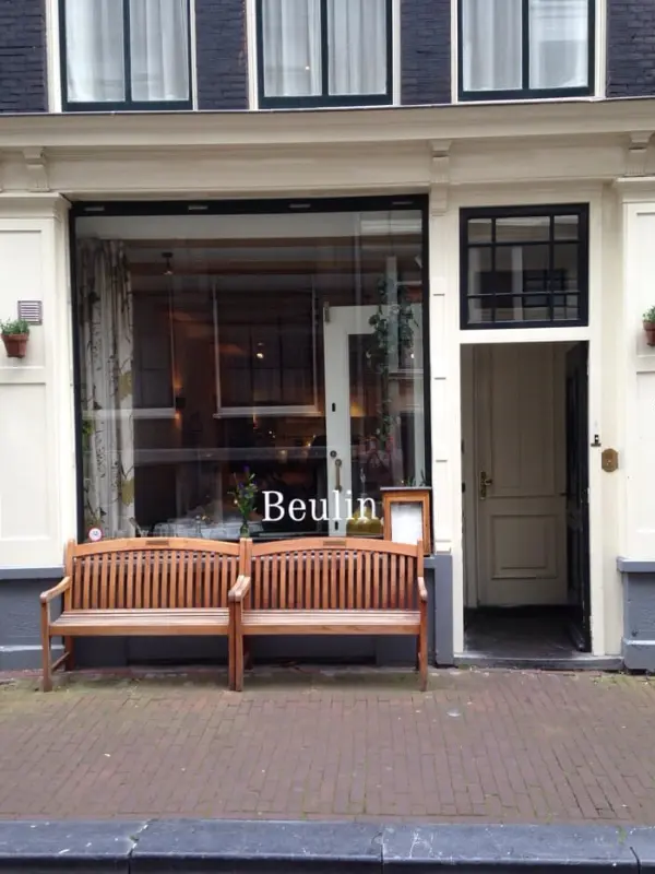 Exterior of Beulings restaurant with a wooden bench outside.