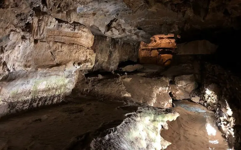 An underground passage with rock formations inside Crystal Cave.