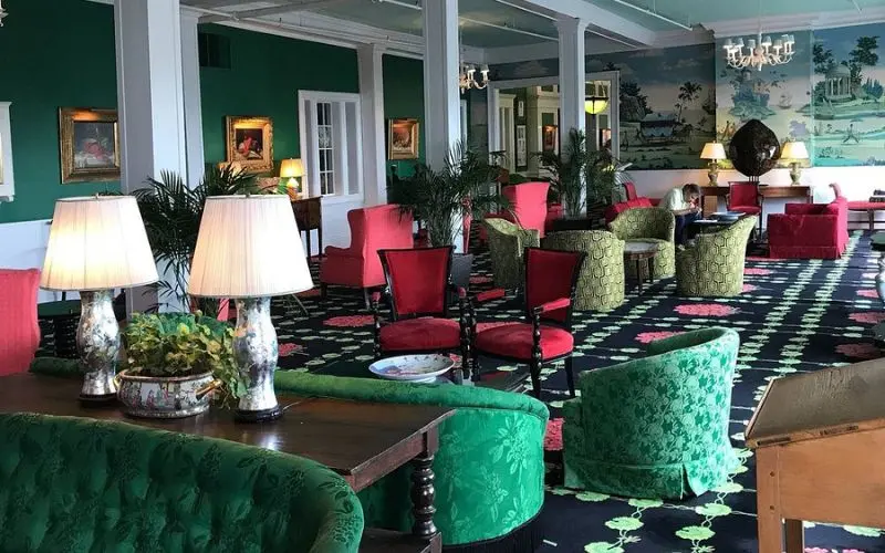 Brightly decorated lounge seating fills the interior of The Grand Hotel.