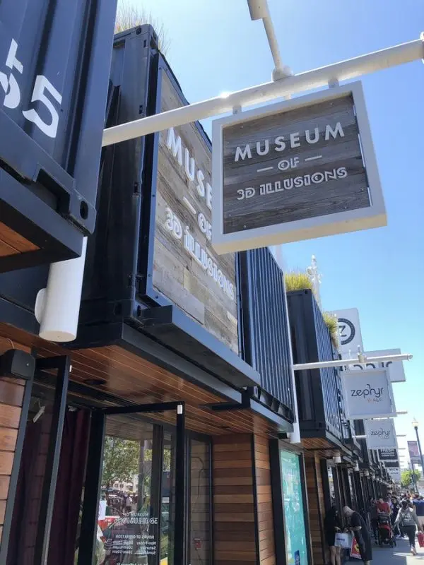 Entrance with wooden signs at The Museum of 3D Illusions.