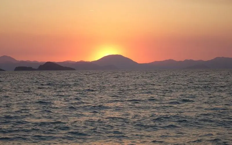 Sunset over the sea at Calis Beach.