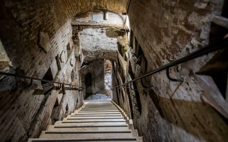 Catacombs of San Callisto in Rome, Italy with stone stairway.