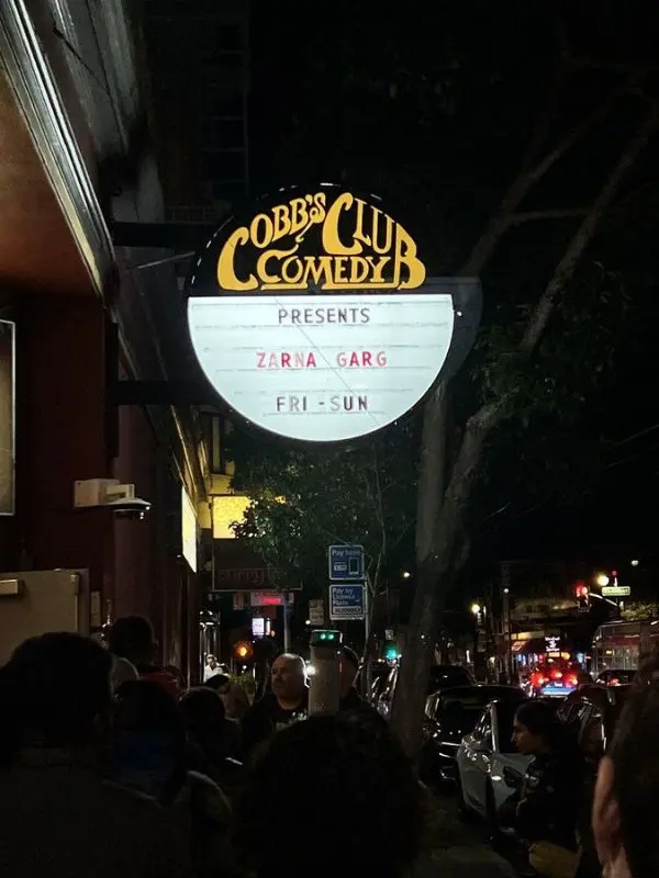 Marquee sign of Cobb’s Comedy Club lit at night.