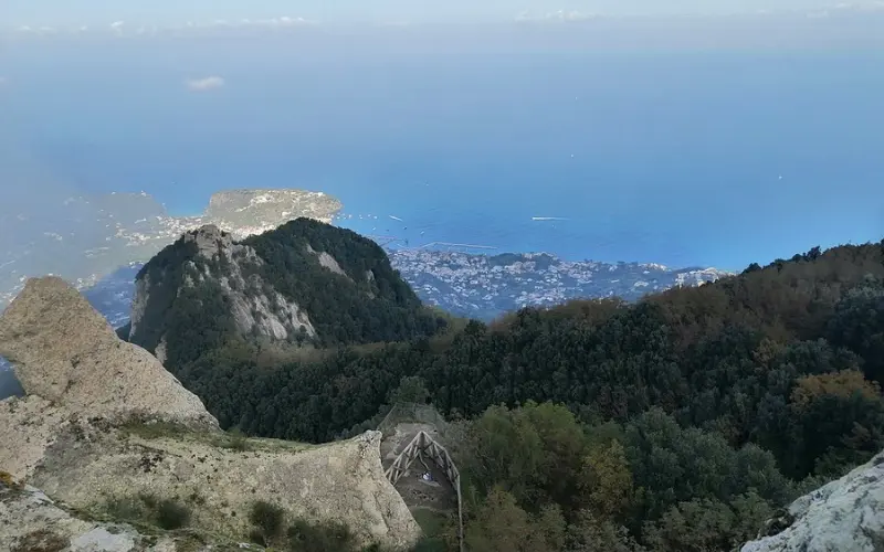 Panoramic view of Mount Epomeo overlooking the sea and towns below.