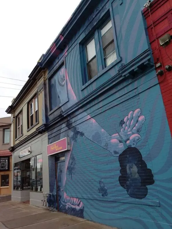 A colorful mural decorates a building in Denver's Art District on Santa Fe.