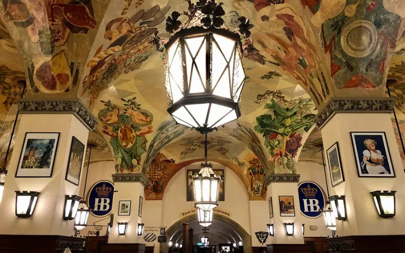 Colorful painted ceilings inside Hofbräuhaus München beer hall.
